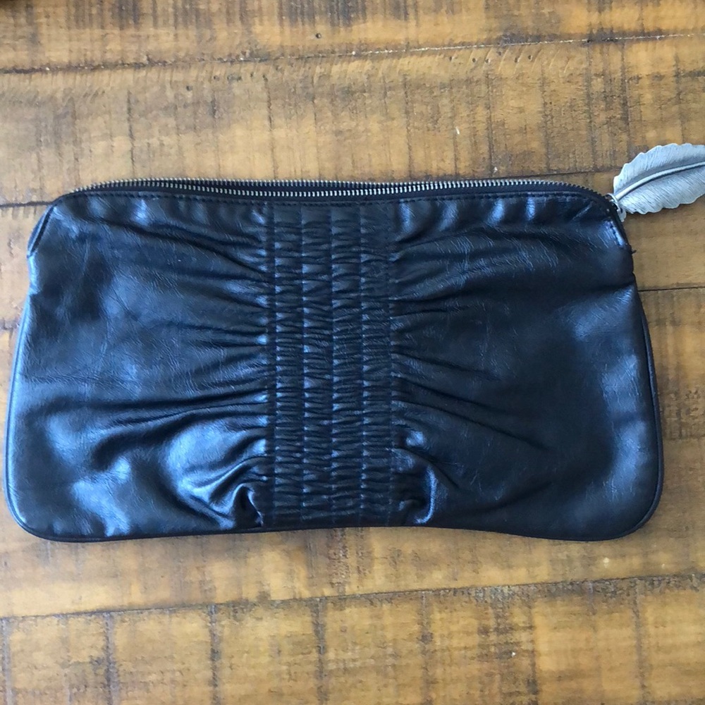 Black leather clutch with silver leaf zipper